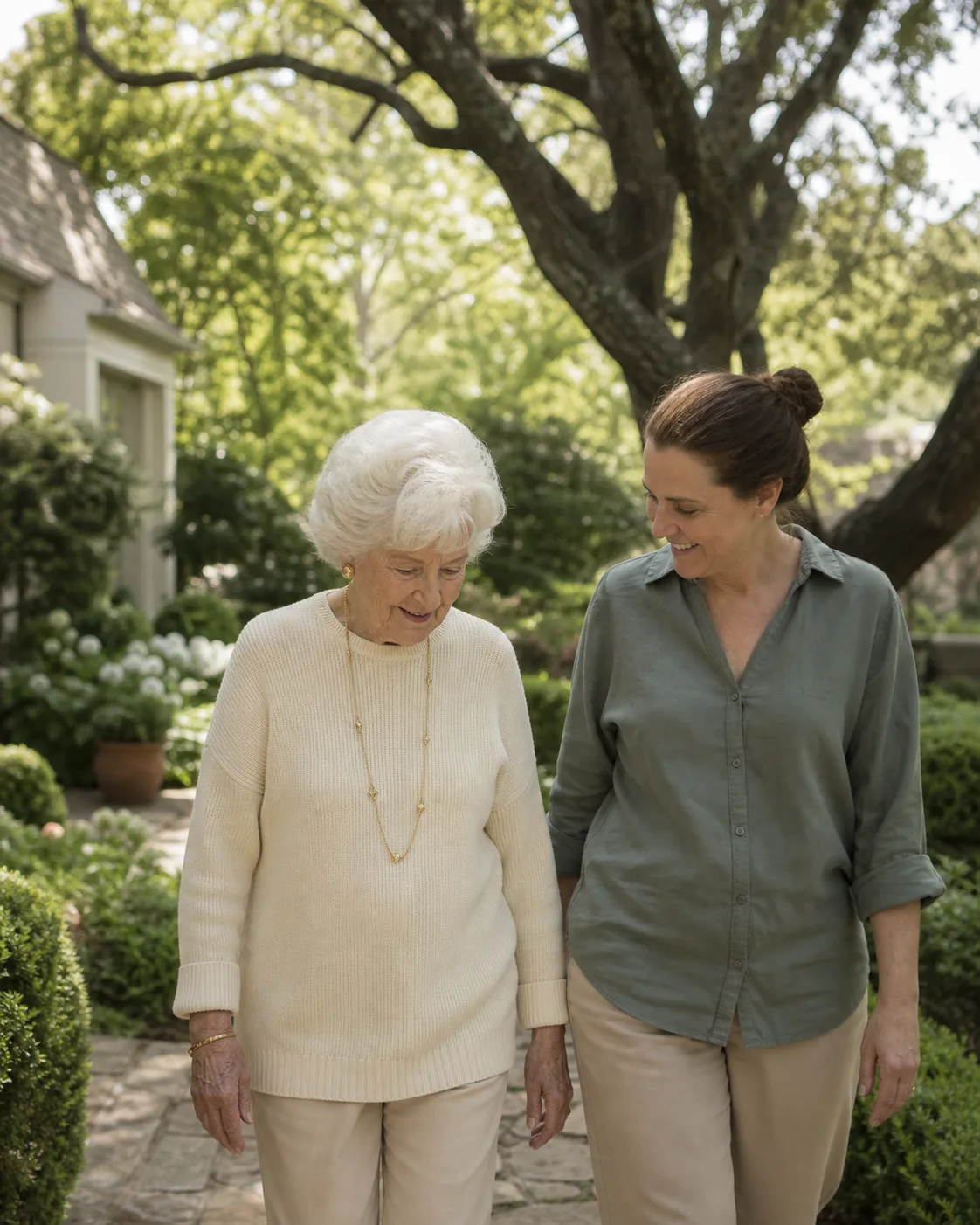An older adult and companion in a garden in Preston Hollow